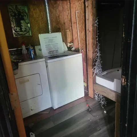 a room with water heater and appliances