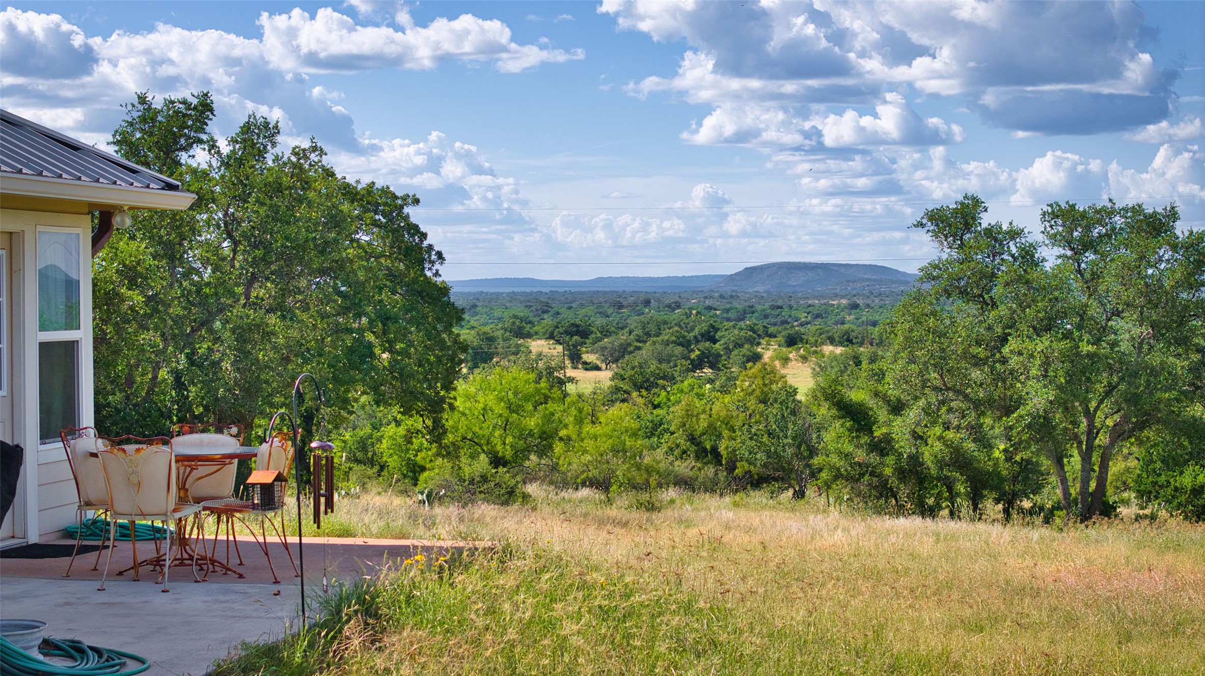 12119 Highway 29 Llano, TX 78643 - Photo 3 of 40 View of mountain background featuring a heavily wooded area