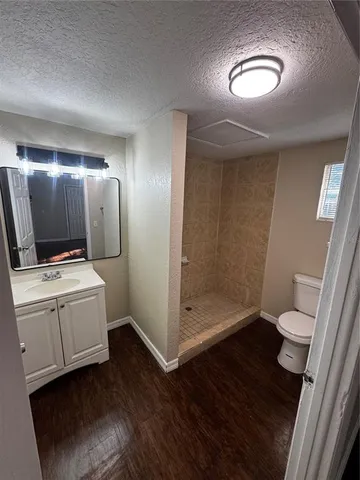 a bathroom with a toilet and a mirror