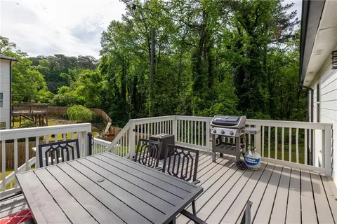a view of balcony with deck and wooden floor