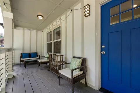 a living room with furniture a wooden floor and a window