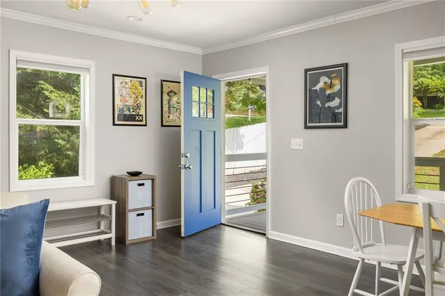 a view of a livingroom with furniture window and wooden floor