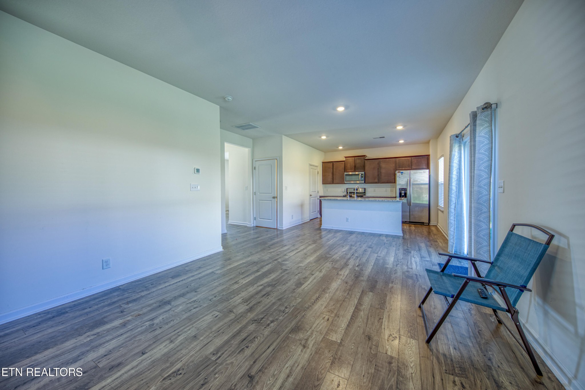 187 Ibis Loop Oak Ridge, TN 37830 - Photo 10 of 21 a view of kitchen and dining room with wooden floor