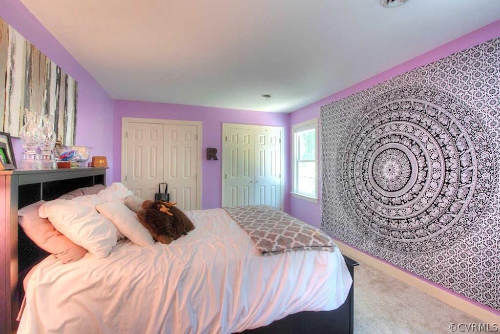 13860 West Salisbury Road Midlothian, VA 23113 - Photo 29 of 40 a bedroom with a bed and a table in it