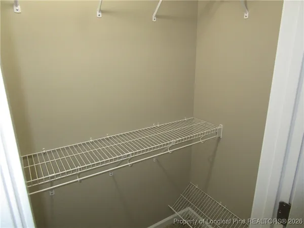 a view of a room with racks on the wall