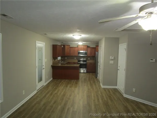 a view of kitchen with wooden floor