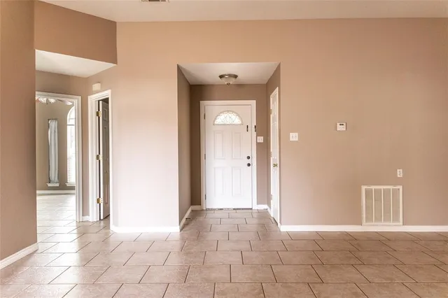 a view of an empty room and window