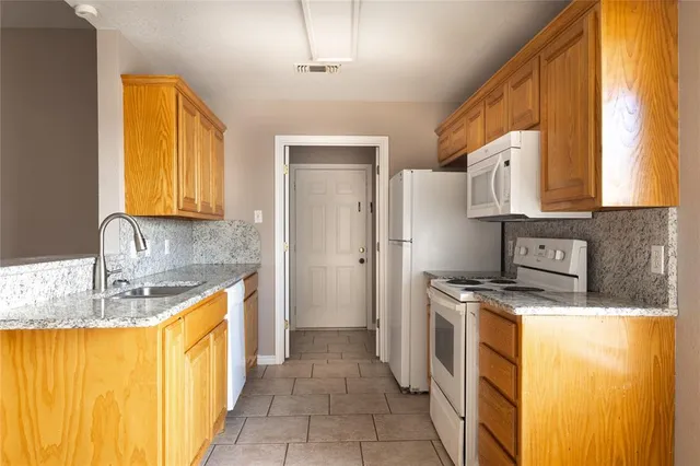 a kitchen with a sink and a window