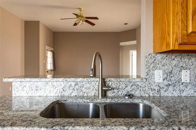a bathroom with a sink a mirror and a shower