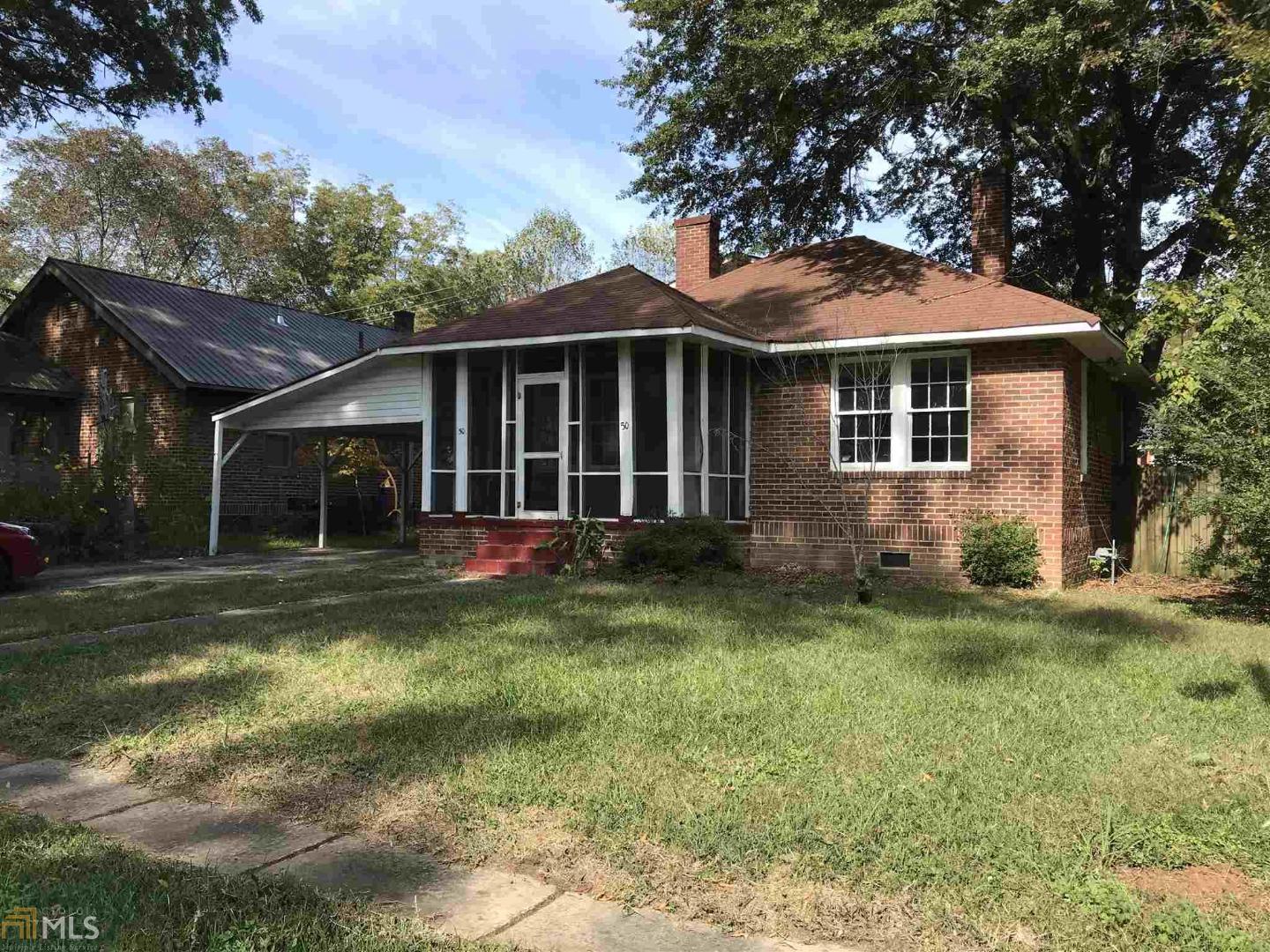 50 Hickory Street Northeast Rome, GA 30161 - Photo 1 of 1 a front view of a house with a garden