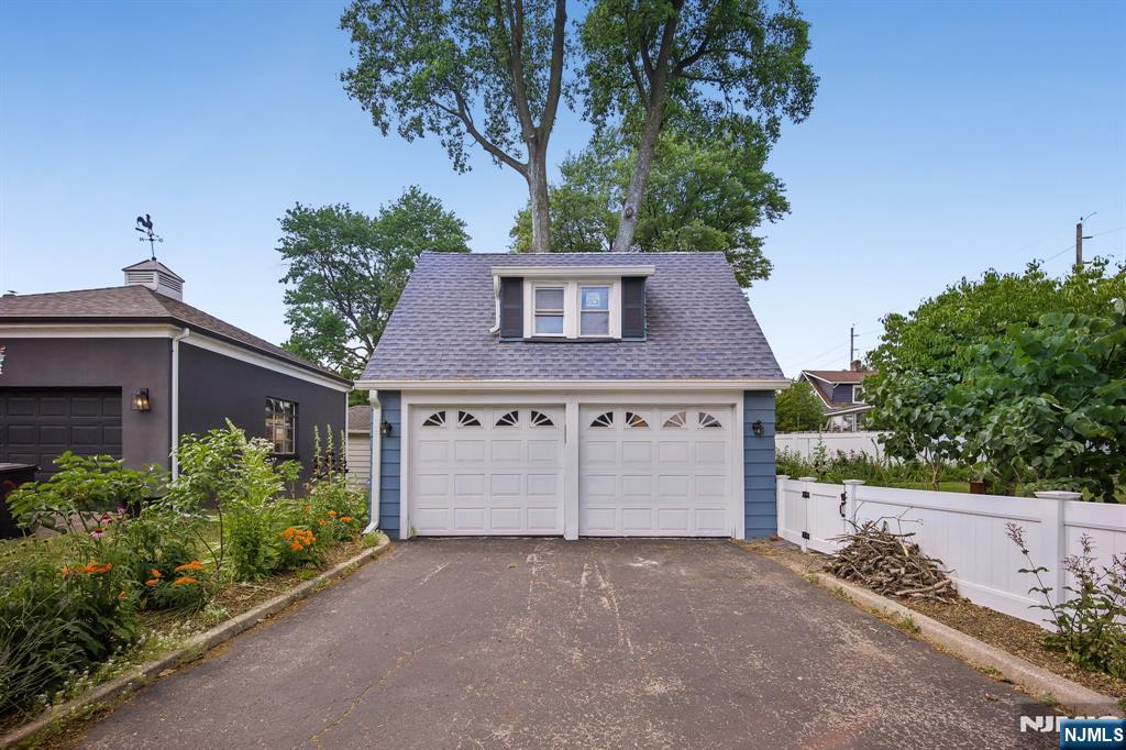 57 Oldis Street Rochelle Park, NJ 07662 - Photo 19 of 19 front view of a house with a garage