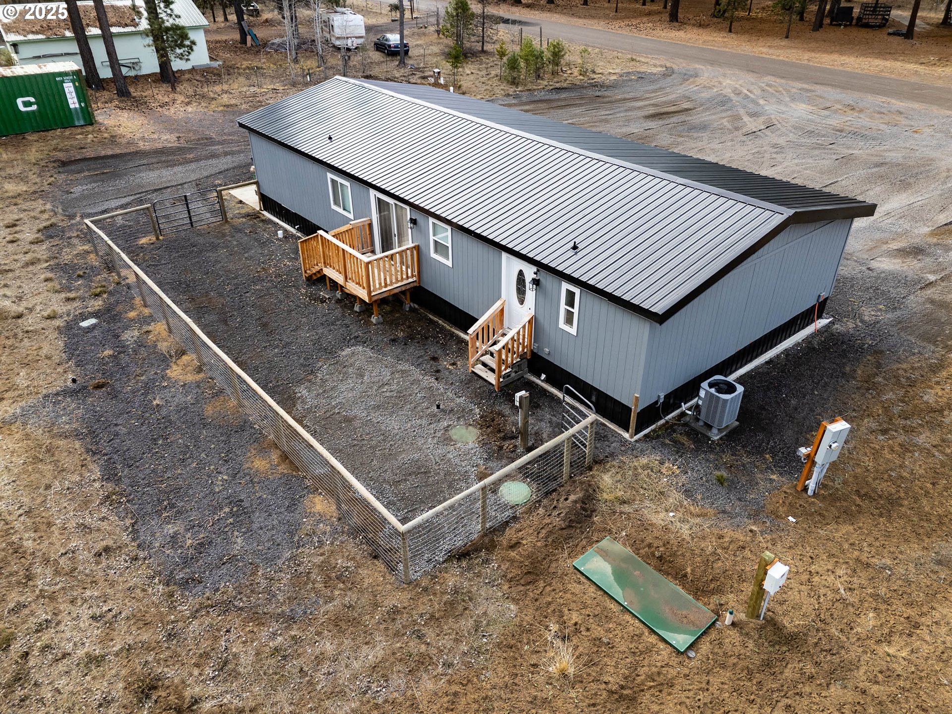 51488 Hann Road La Pine, OR 97739 - Photo 11 of 30 a view of a roof deck with wooden floor and a yard