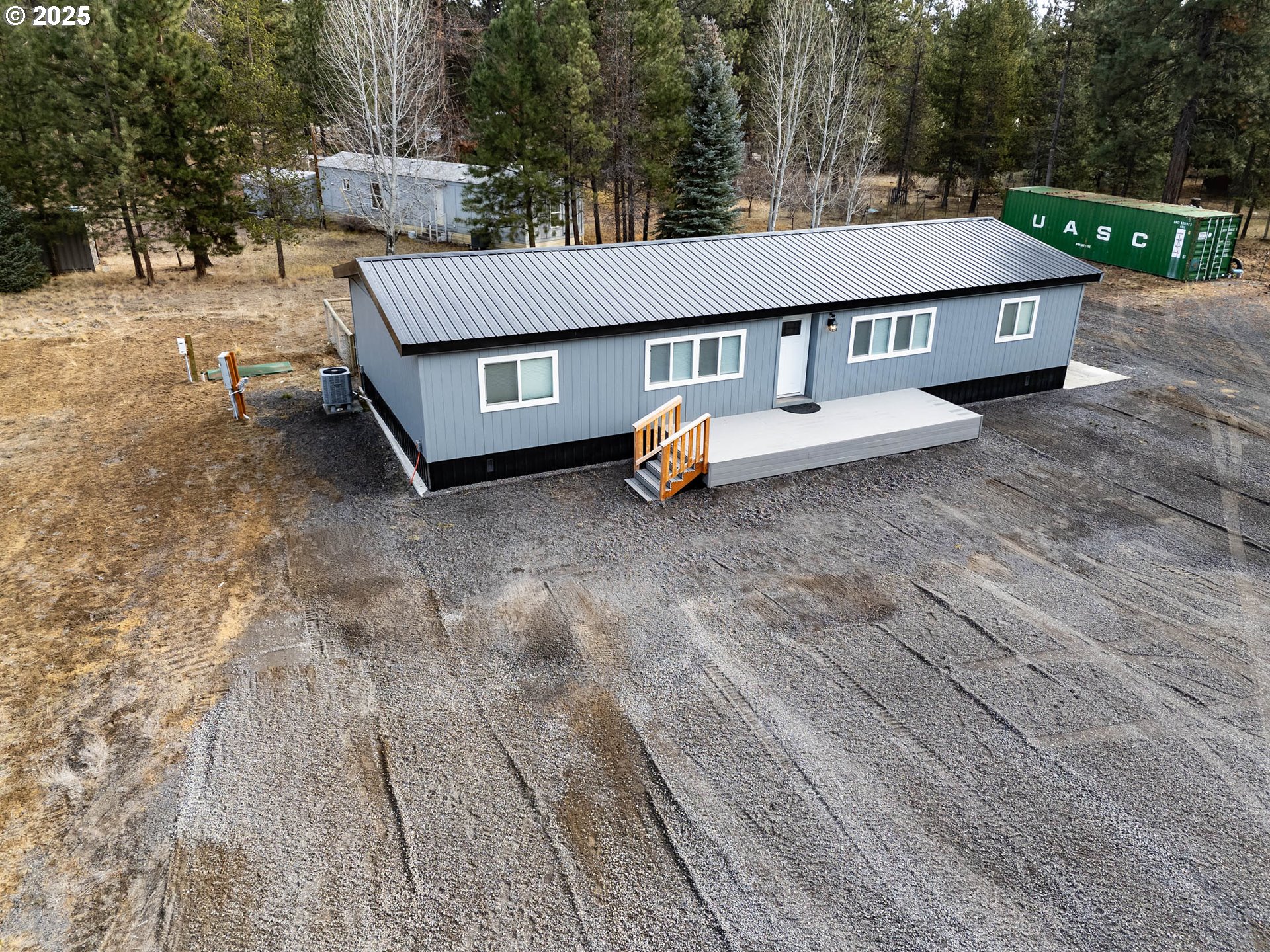 51488 Hann Road La Pine, OR 97739 - Photo 13 of 30 a view of a white house and outdoor space