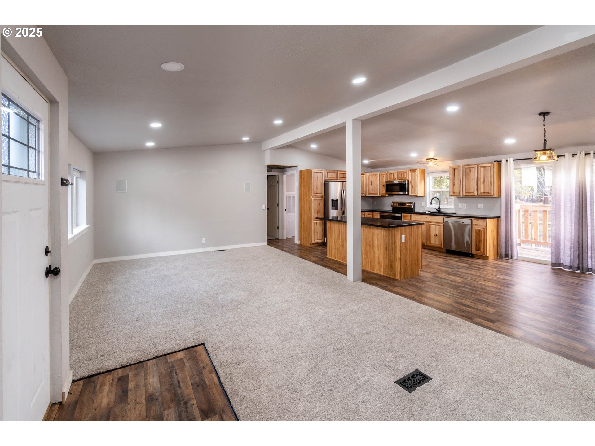 51488 Hann Road La Pine, OR 97739 - Photo 16 of 30 a view of a living room and kitchen with a sink