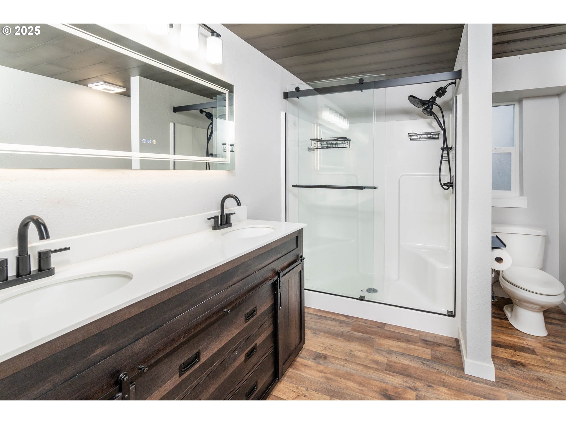 51488 Hann Road La Pine, OR 97739 - Photo 21 of 30 a bathroom with a sink a toilet a shower and a mirror