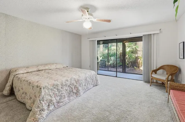 a room that has a bed and a window in it