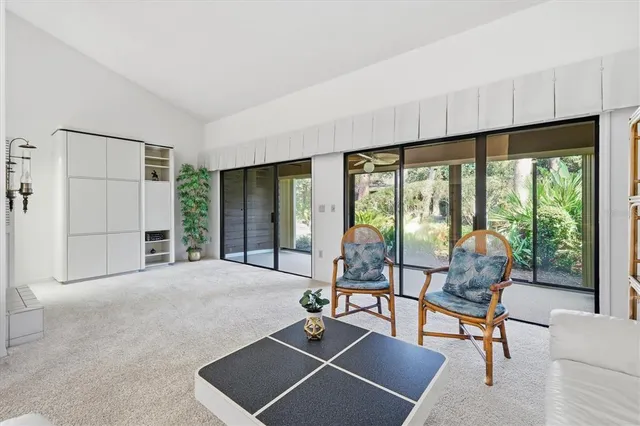a living room with furniture and a lamp