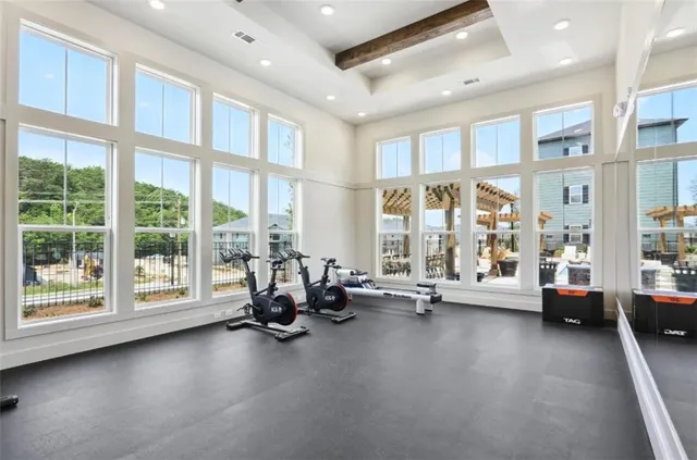 a lobby with furniture and floor to ceiling window