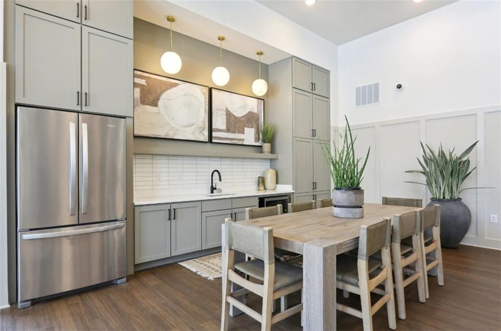 75 Overlook Parkway Southeast, Unit 324 Cartersville, GA 30121 - Photo 21 of 21 a kitchen with stainless steel appliances a refrigerator a sink a table and chairs