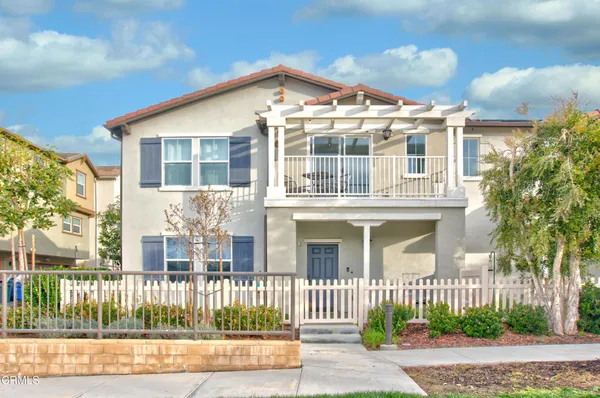 front view of a house with a fence