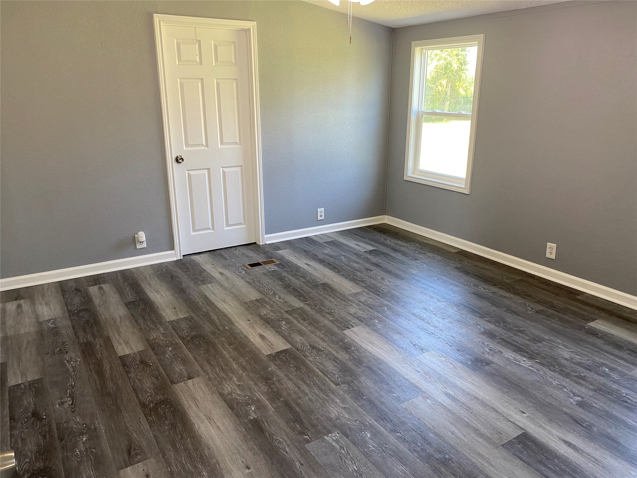 6115 Highway 35 Alvin, TX 77511 - Photo 23 of 49 a view of an empty room with wooden floor and a window