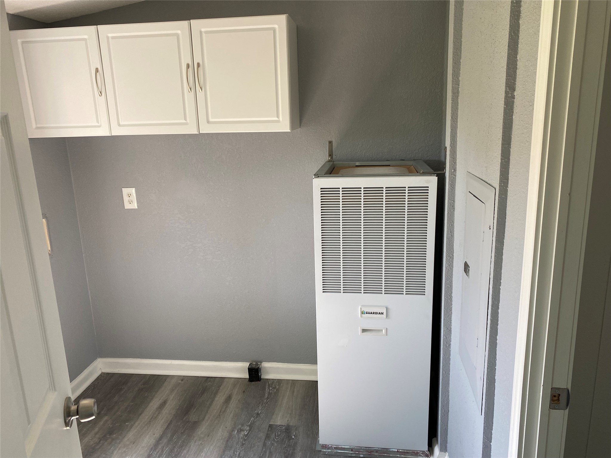 6115 Highway 35 Alvin, TX 77511 - Photo 25 of 49 a view of an empty room with wooden floor and a window