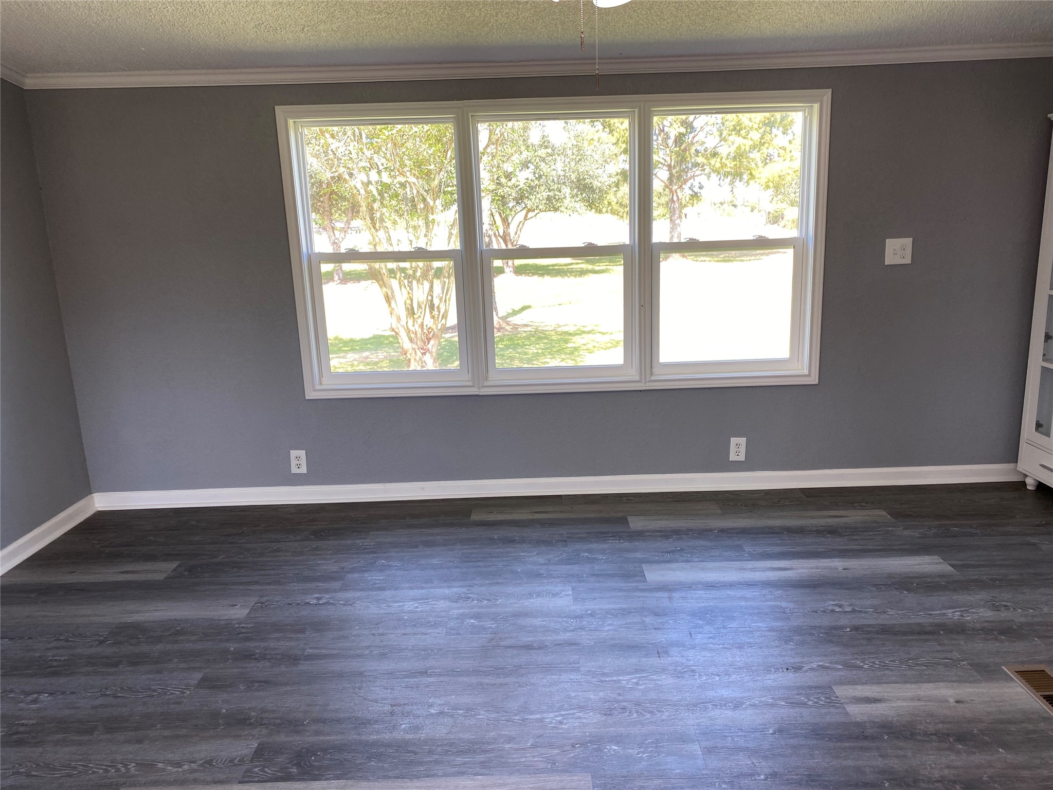 6115 Highway 35 Alvin, TX 77511 - Photo 28 of 49 a view of an empty room with wooden floor and a window