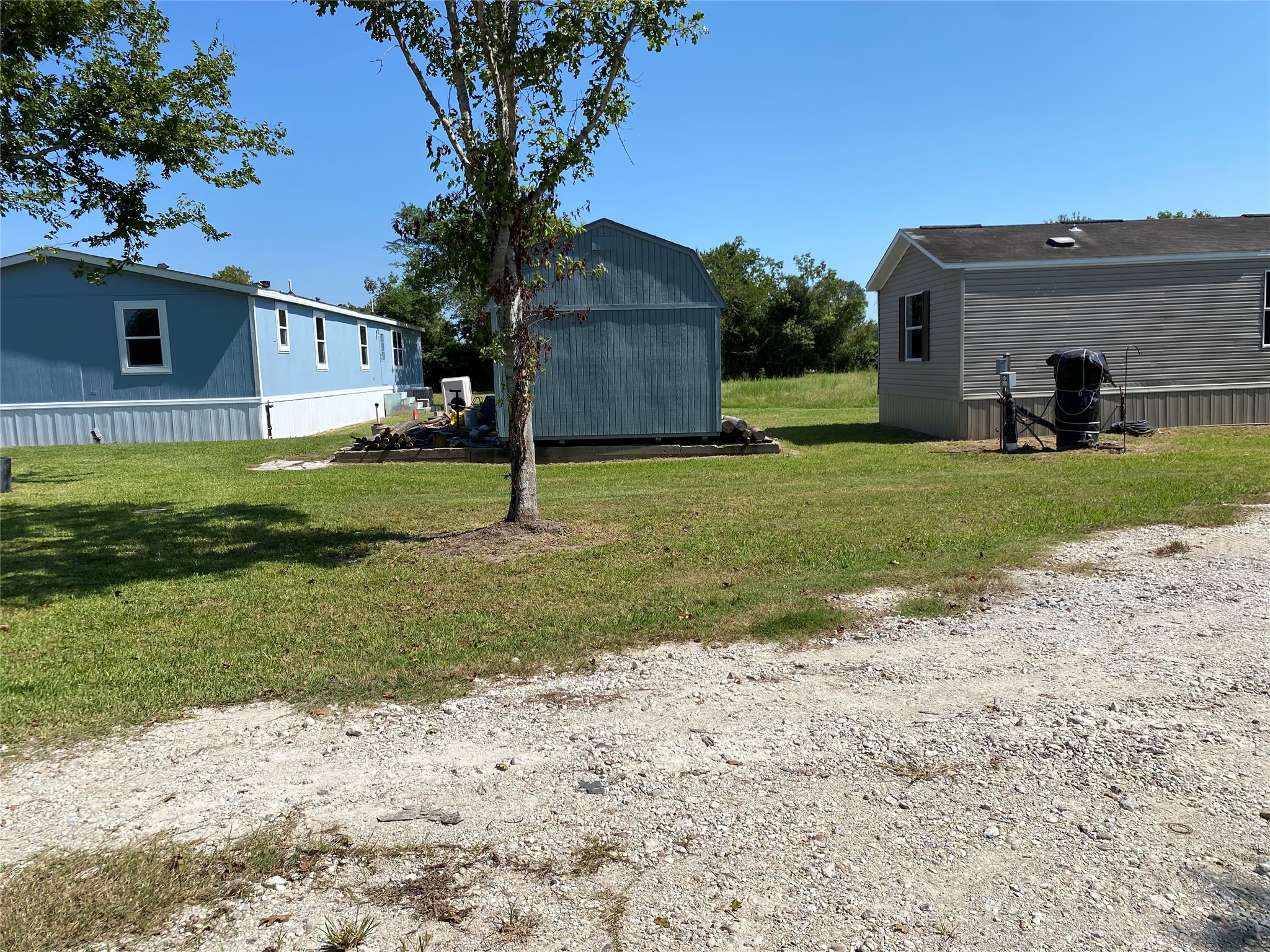 6115 Highway 35 Alvin, TX 77511 - Photo 32 of 49 a view of a house with a yard