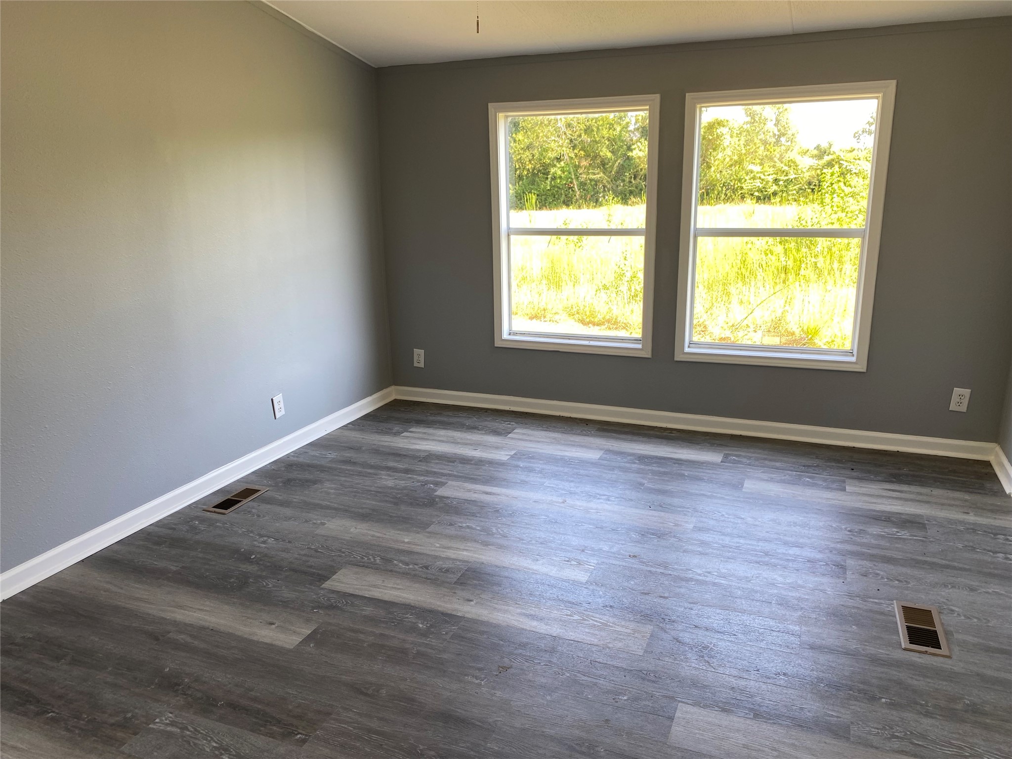 6115 Highway 35 Alvin, TX 77511 - Photo 34 of 49 an empty room with wooden floor and windows