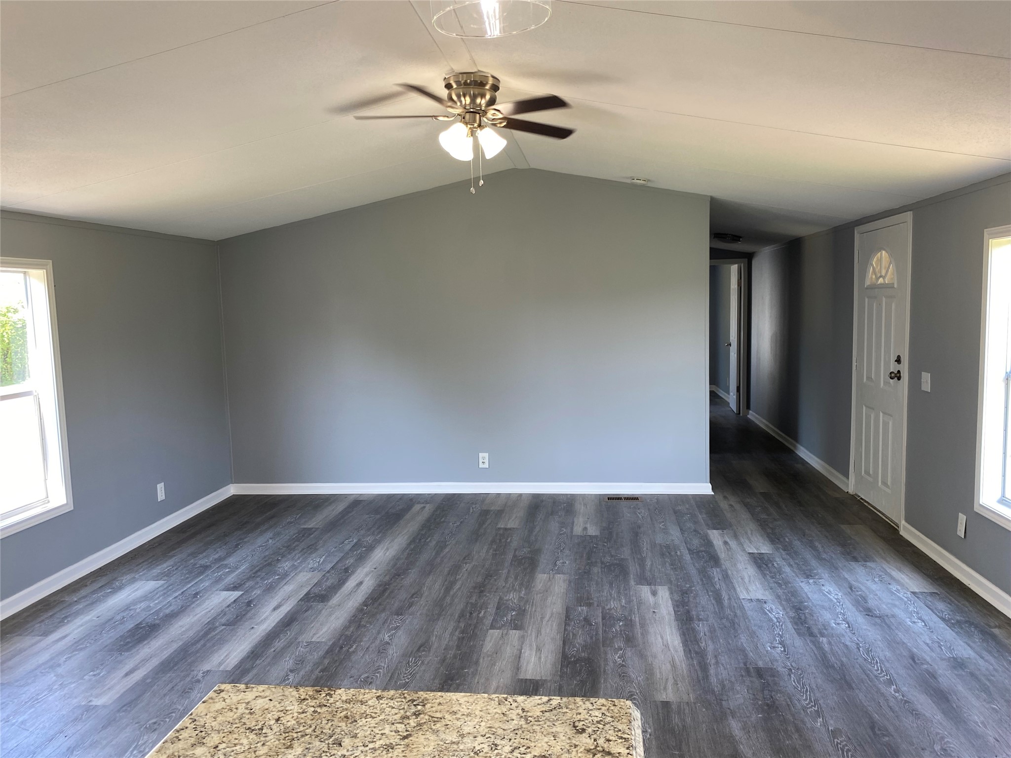 6115 Highway 35 Alvin, TX 77511 - Photo 37 of 49 wooden floor in an empty room with a window