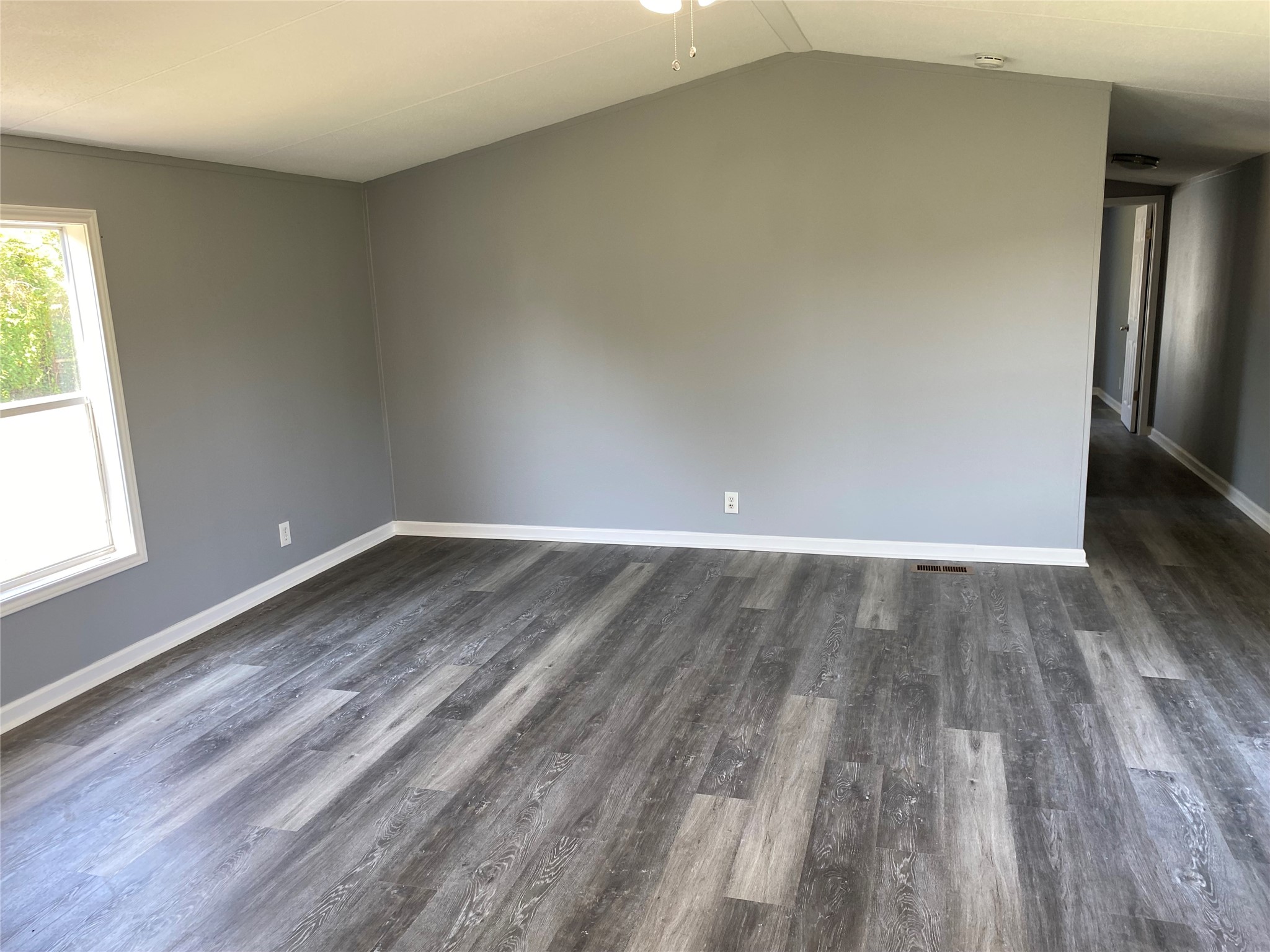 6115 Highway 35 Alvin, TX 77511 - Photo 41 of 49 an empty room with wooden floor and windows