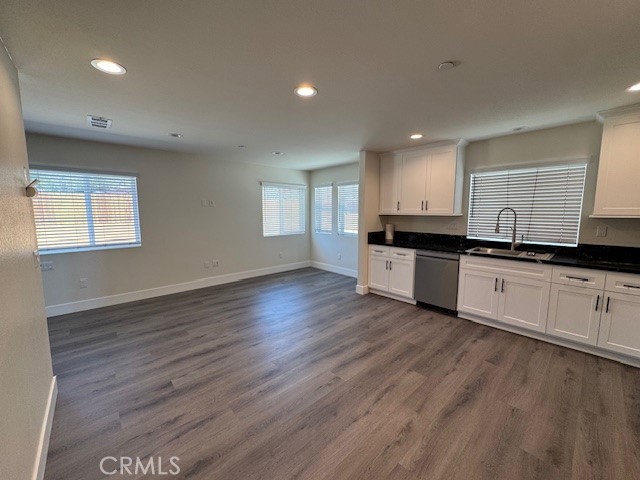 510 Ellis Lake, Unit 1 Lake Elsinore, CA 92530 - Photo 20 of 25 a kitchen with granite countertop a sink and cabinets
