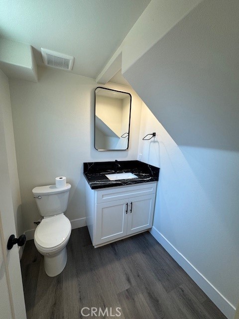 510 Ellis Lake, Unit 1 Lake Elsinore, CA 92530 - Photo 22 of 25 a bathroom with a toilet sink and mirror