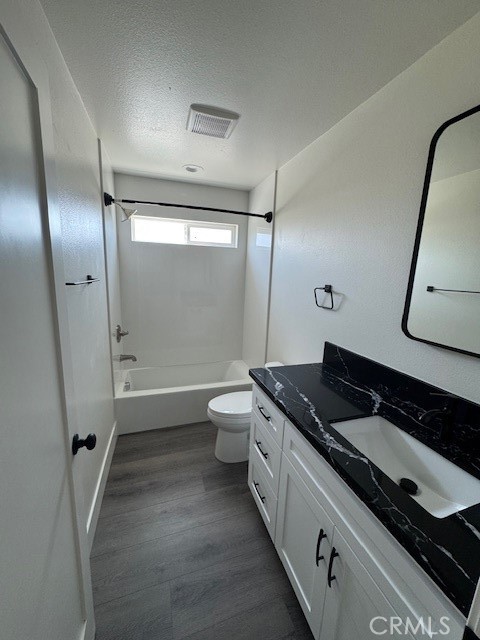 510 Ellis Lake, Unit 1 Lake Elsinore, CA 92530 - Photo 4 of 25 a bathroom with a granite countertop sink toilet and shower