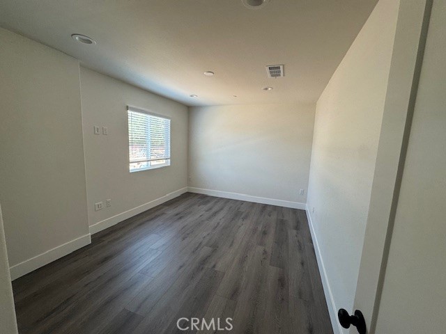 510 Ellis Lake, Unit 1 Lake Elsinore, CA 92530 - Photo 5 of 25 a view of a room with wooden floor and window