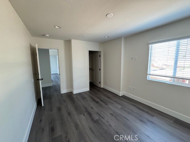 510 Ellis Lake, Unit 1 Lake Elsinore, CA 92530 - Photo 6 of 25 an empty room with wooden floor and a window