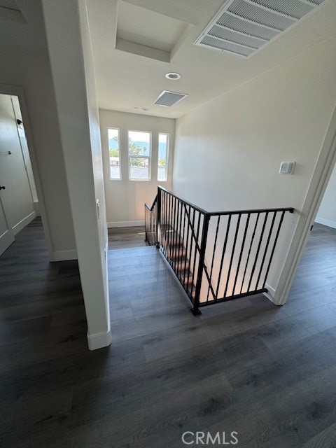 510 Ellis Lake, Unit 1 Lake Elsinore, CA 92530 - Photo 8 of 25 a view of a hallway with wooden floor and windows