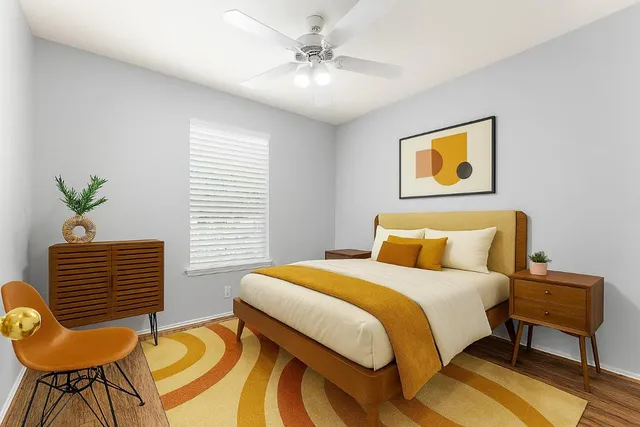 a bedroom with a bed and a window