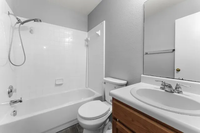 a view of backyard of house and garage