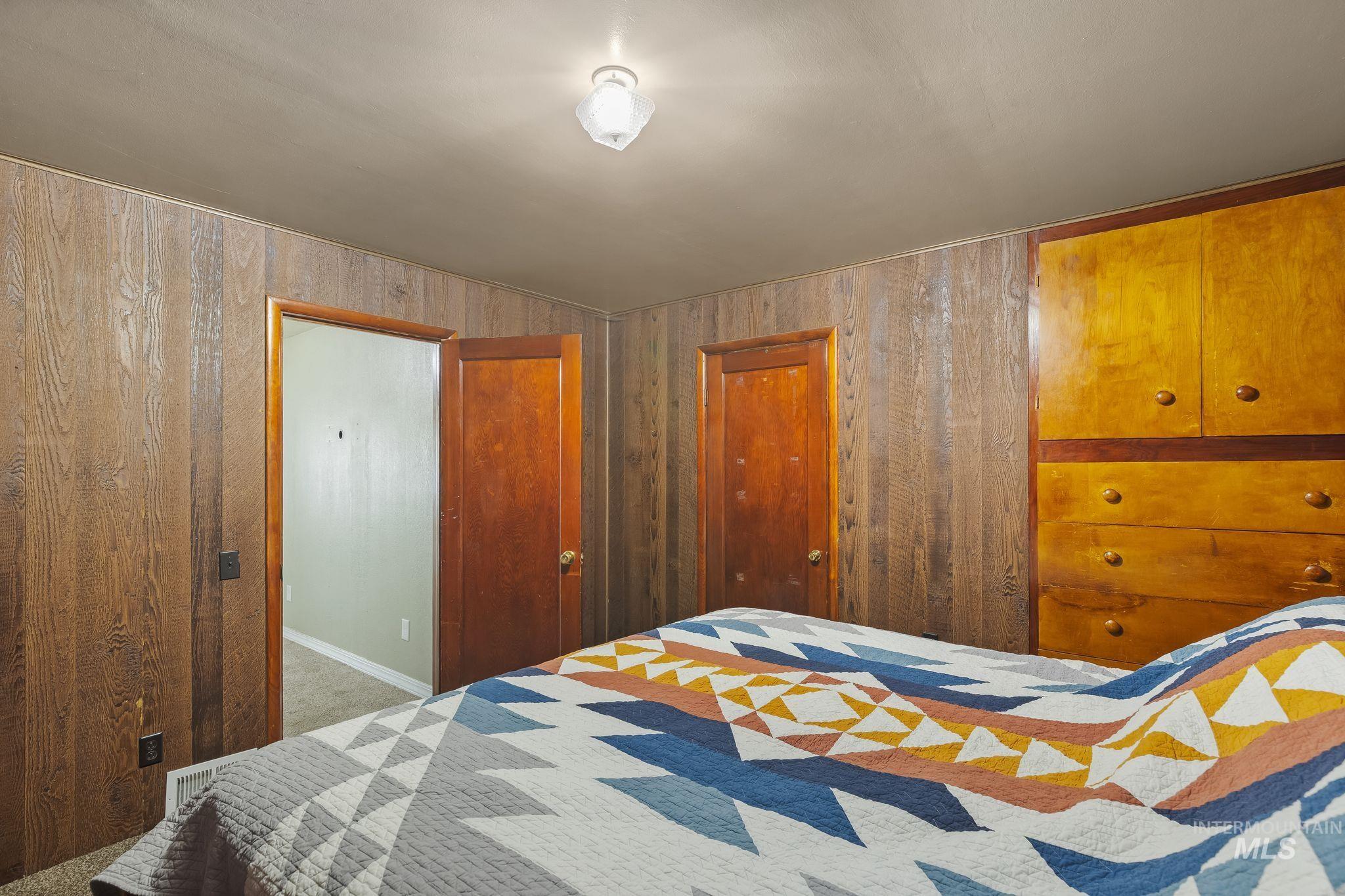 2255 Appleside Boulevard Clarkston, WA 99403 - Photo 22 of 41 Wood-paneled room featuring recessed windows, a ceiling-mounted light fixture, and carpet flooring