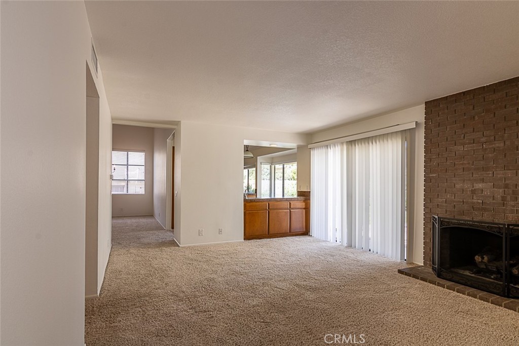 24 Brena Irvine, CA 92620 - Photo 14 of 28 a view of an empty room with a fireplace and a window