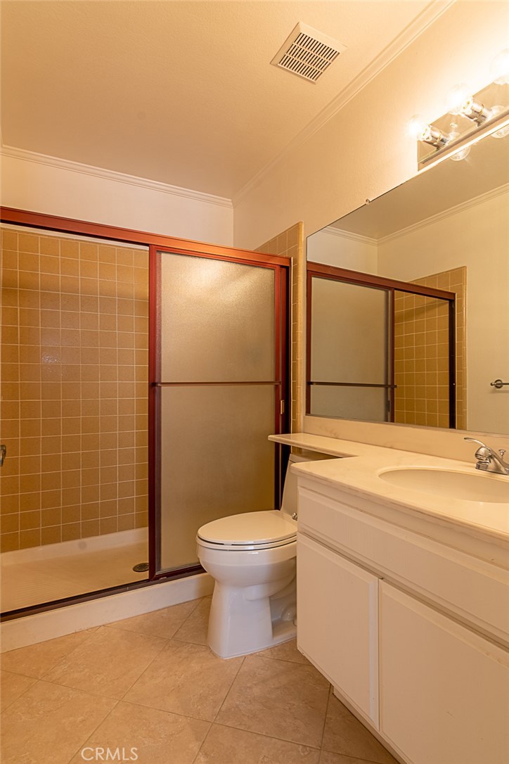 24 Brena Irvine, CA 92620 - Photo 21 of 28 a bathroom with a granite countertop sink toilet and shower