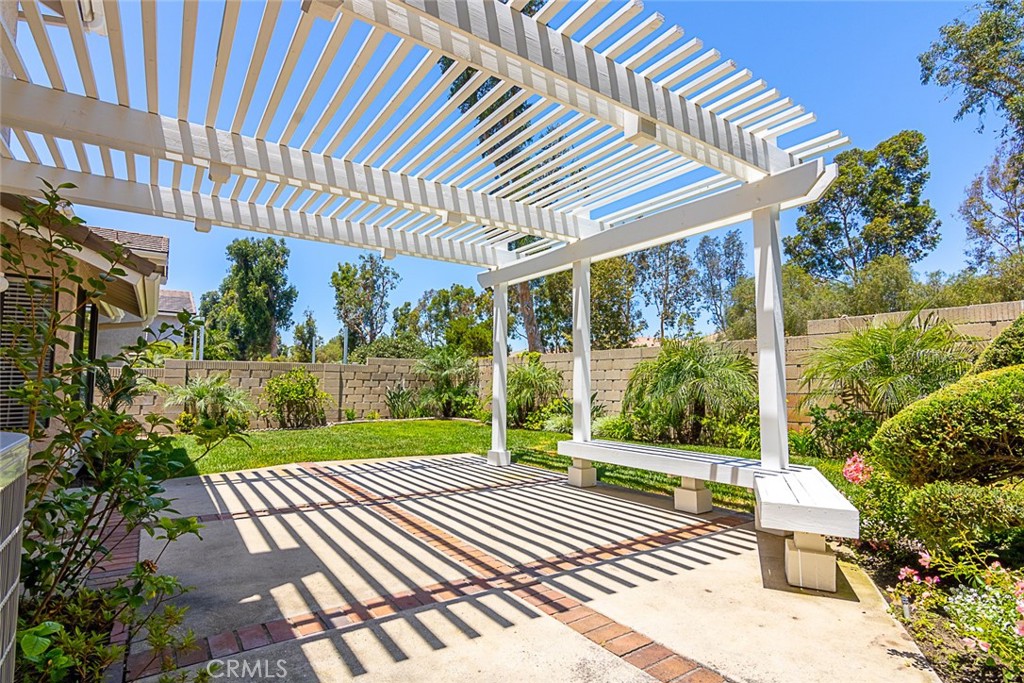 24 Brena Irvine, CA 92620 - Photo 4 of 28 a view of a patio with a table and chairs next to a yard