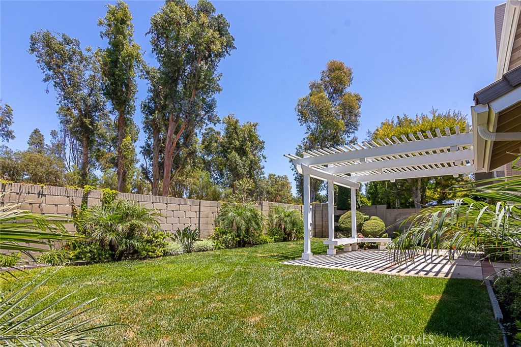 24 Brena Irvine, CA 92620 - Photo 5 of 28 a view of a backyard with couches plants and large trees