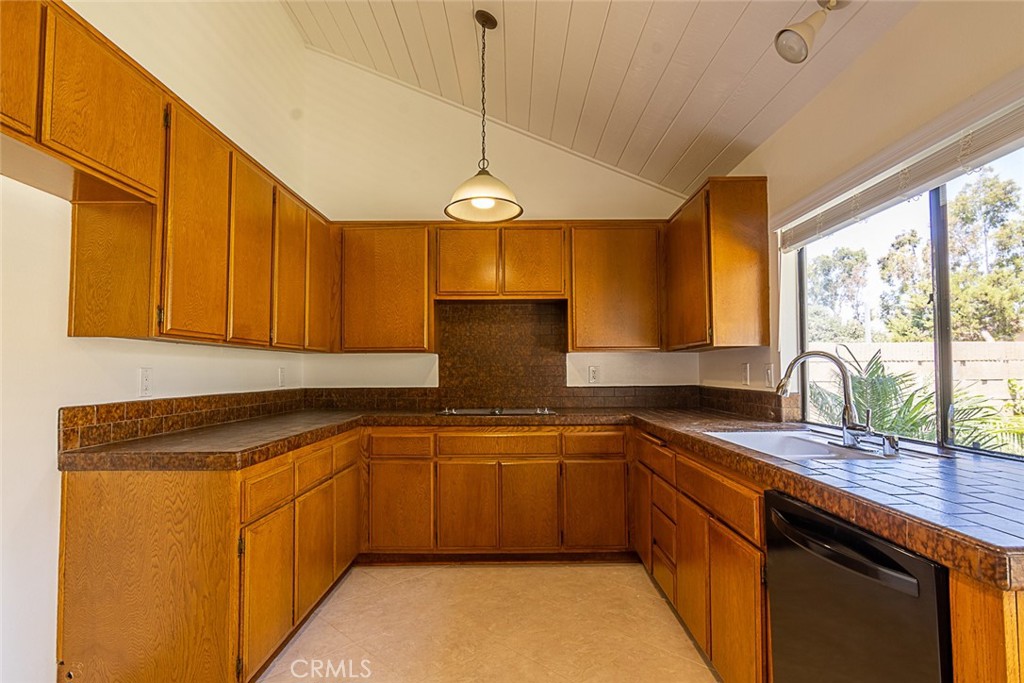 24 Brena Irvine, CA 92620 - Photo 10 of 28 a kitchen with stainless steel appliances granite countertop a sink a stove cabinets and wooden floor