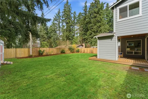 a view of a backyard with a small cabin
