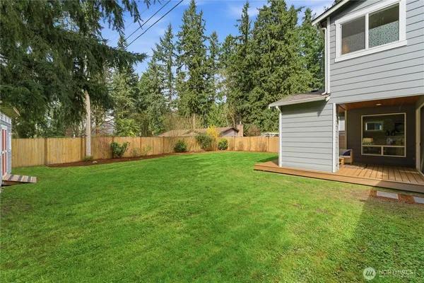 a view of a backyard with a small cabin