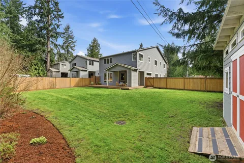 a view of backyard with a garden and plants