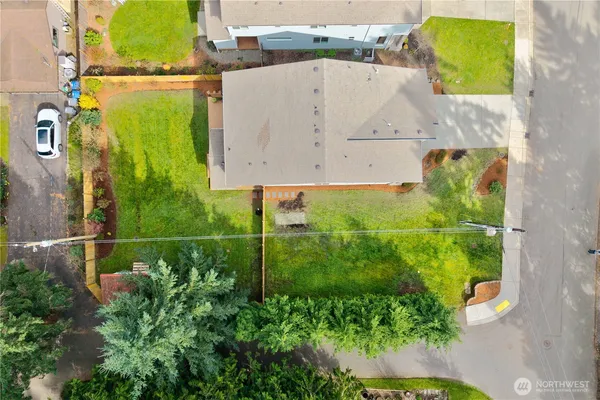 an aerial view of residential house with outdoor space and swimming pool