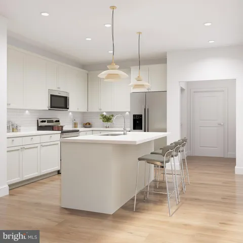 a living room with furniture a chandelier and a large window